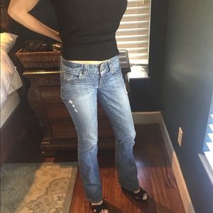 Distressed, flared Guess jeans.